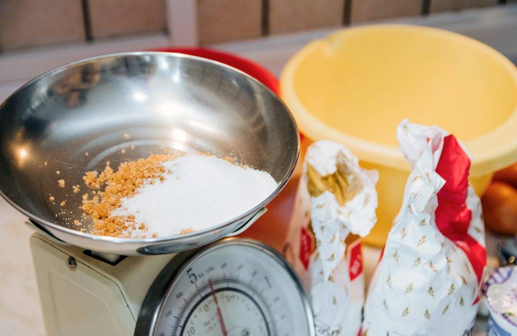 Close-up of ingredients for cooking and baking on kitchen scale.