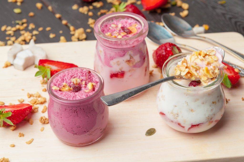 Healthy summer breakfast. Jar with granola, yoghurt and strawberry