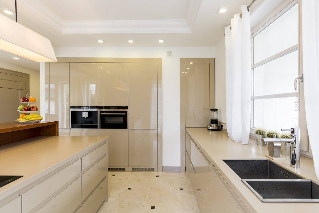 Kitchen with bright furnitures and sink