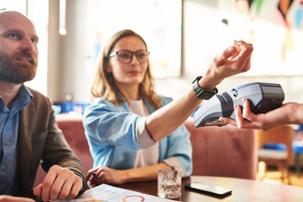 Paying with smart watch in cafe