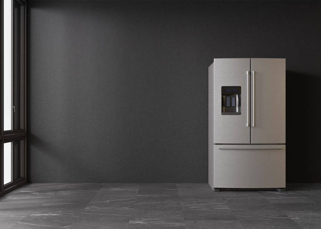 Refrigerator standing in empty room. Free, copy space for text or other objects. Household