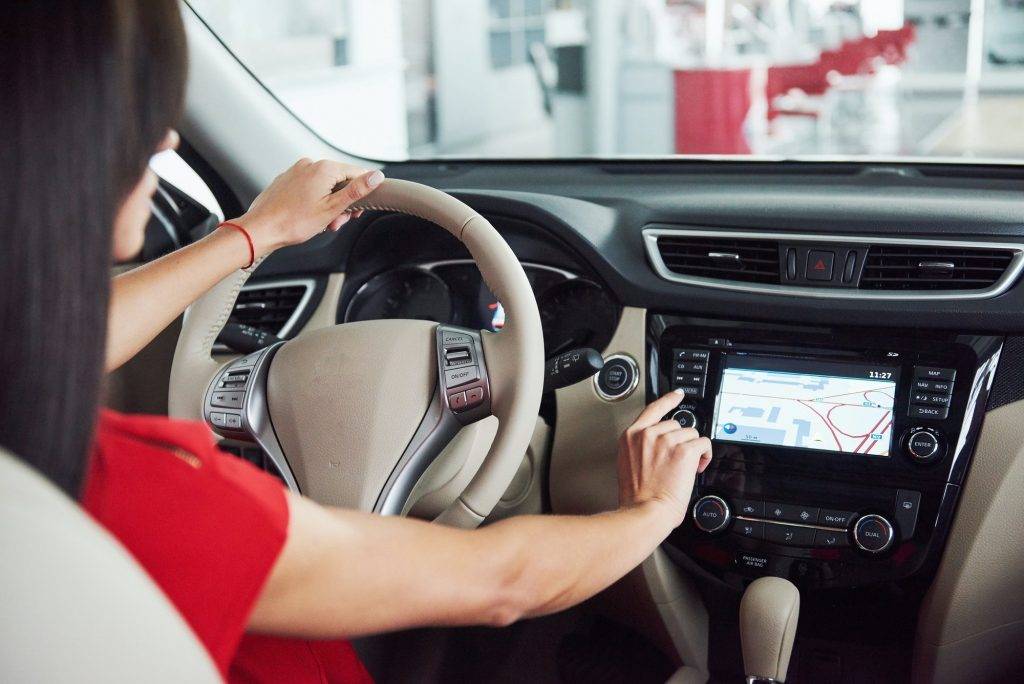Smart car and internet of things IOT concept. Finger point to car 's console and icons popup out