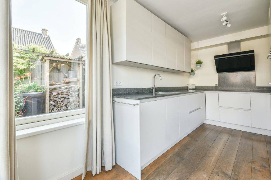 Kitchen with a modern cooker hood